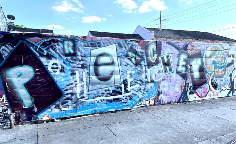 A graffiti war pitted muralists against taggers on a St. C.jpeg