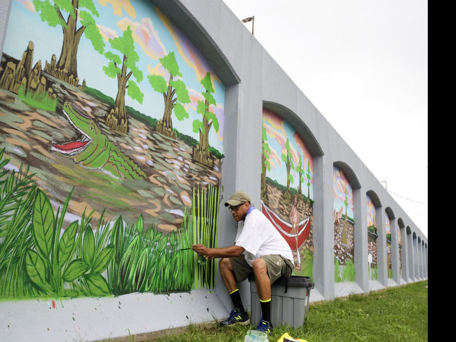 Sprucing Up A New Orleans Floodwall On Tchoupitoulas A Mile Long