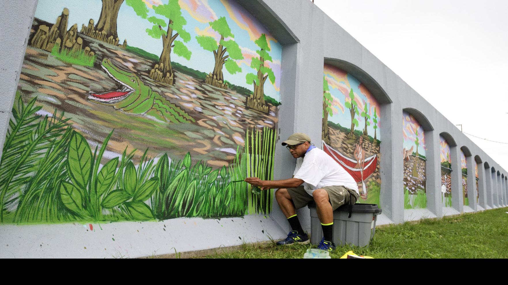 Sprucing Up A New Orleans Floodwall On Tchoupitoulas A Mile Long