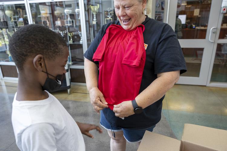 As more New Orleans families struggle to buy school uniforms, one group