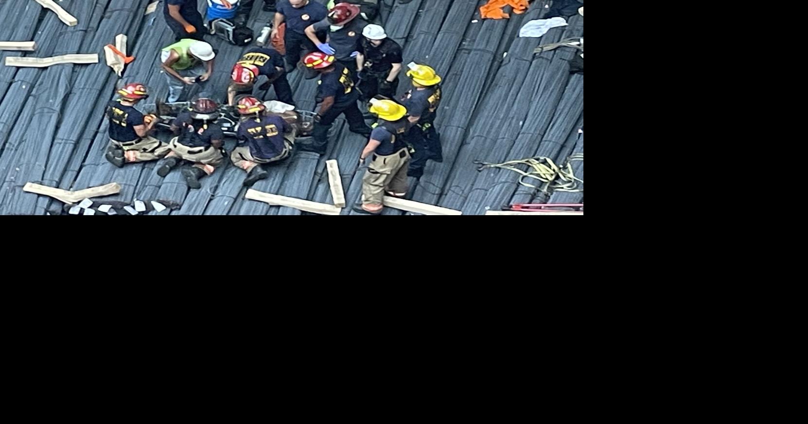 Firefighters rappel 60 feet into hull of ship to rescue man who fell at ...
