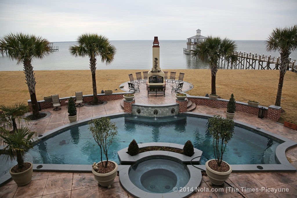 On the shores of Lake Pontchartrain, a Mandeville home sits on land