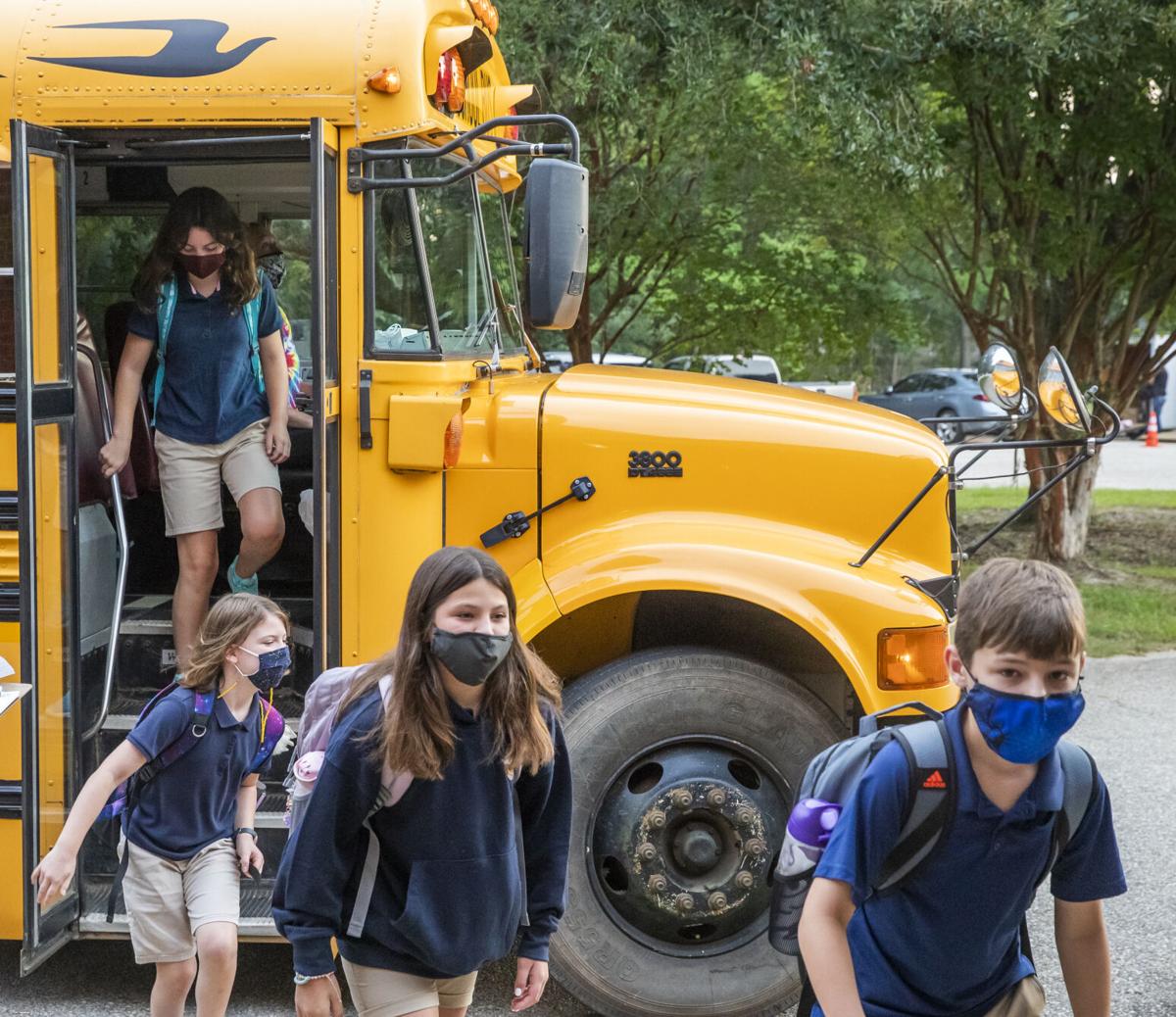 Photos Kids climb out of cars, trucks and buses on the first day at
