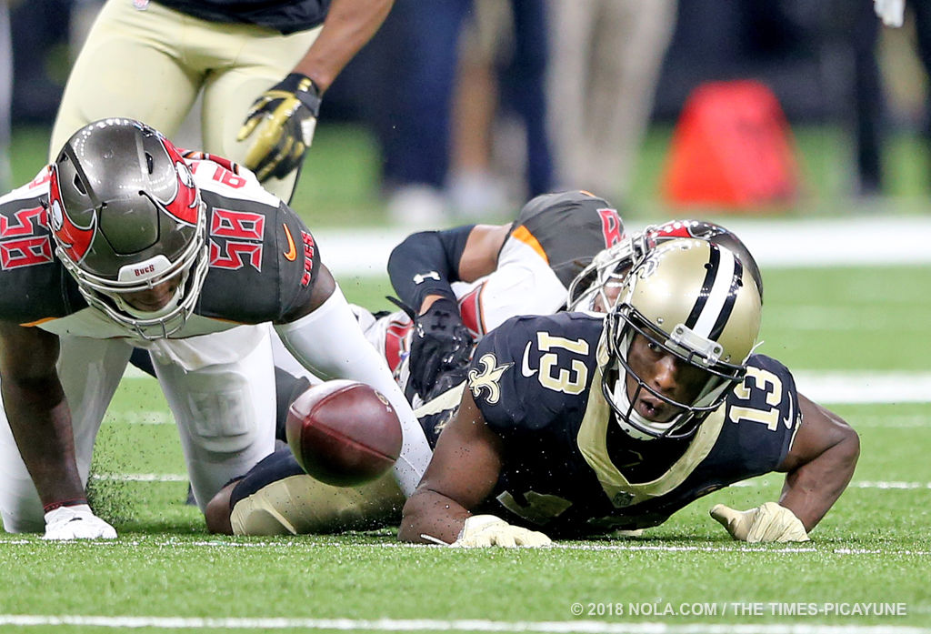 Tampa Bay Buccaneers wide receiver Mike Evans (13) makes a catch in front  of New Orleans Saints cornerback Marshon Lattimore (23) on a two-point  conversion during the second half of an NFL