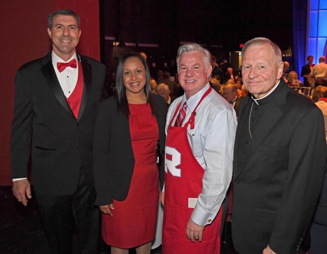 Archbishop Rummel High School celebrity waiters vie for tips at soiree ...