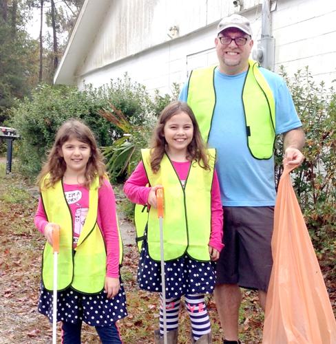 Cleanup attracts residents, families to held Military Road maintenance (copy)