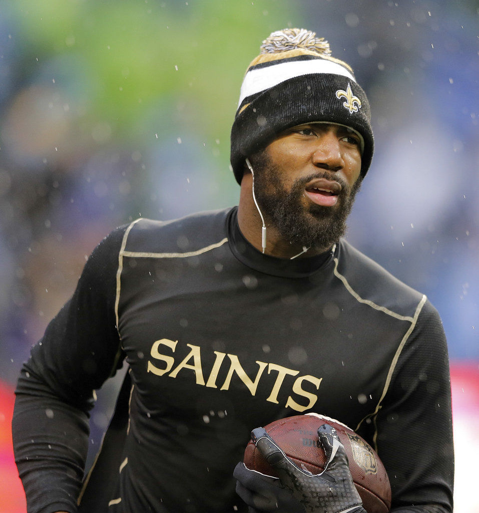 A stunned New Orleans Saints' Roman Harper walks off the field as the  Seattle Seahawks' celebrate their 41-36 win over the Super Bowl Defending  Champions in the NFC's wild-card playoff game on