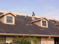 Willie and James Mackie, up on the roof in 2004