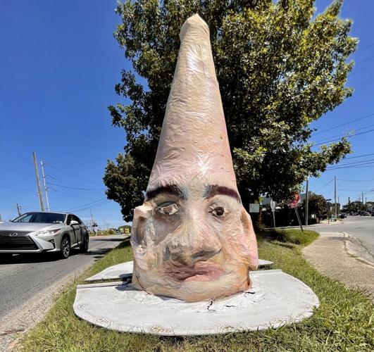 Mysterious cone-headed sculpture appears at Uptown intersection – 'Take me  to your potholes', Arts