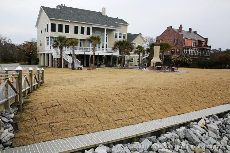 On the shores of Lake Pontchartrain, a Mandeville home sits on land