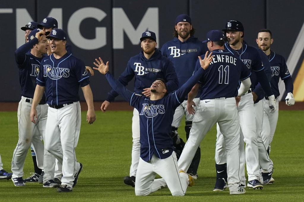 Photos: Randy Arozarena lays on home plate after game-winning run