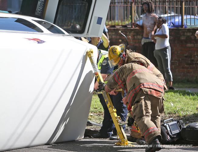 Medical transport van overturns in crash with SUV in Central City