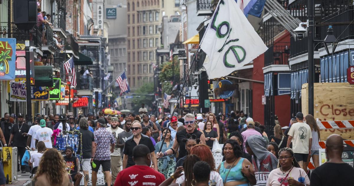 Meet the New Orleans man who runs down Bourbon Street waving a homemade 'love' flag