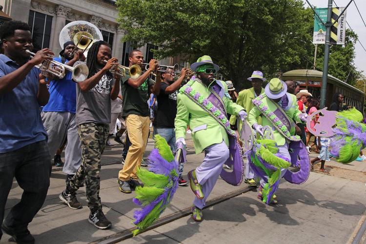 Pigeon Town Steppers' annual Easter secondline draws a lively crowd