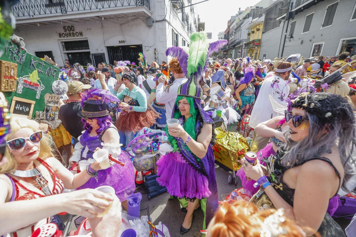 Mardi Gras revelers flock to the French Quarter Friday