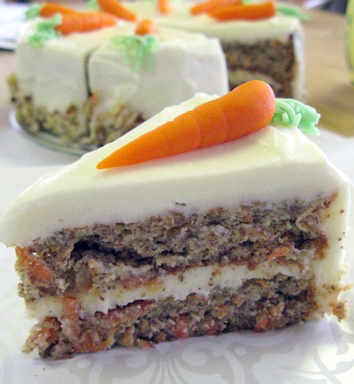 Three mini carrot cakes with marzipan carrots and Easter decoration stock  photo