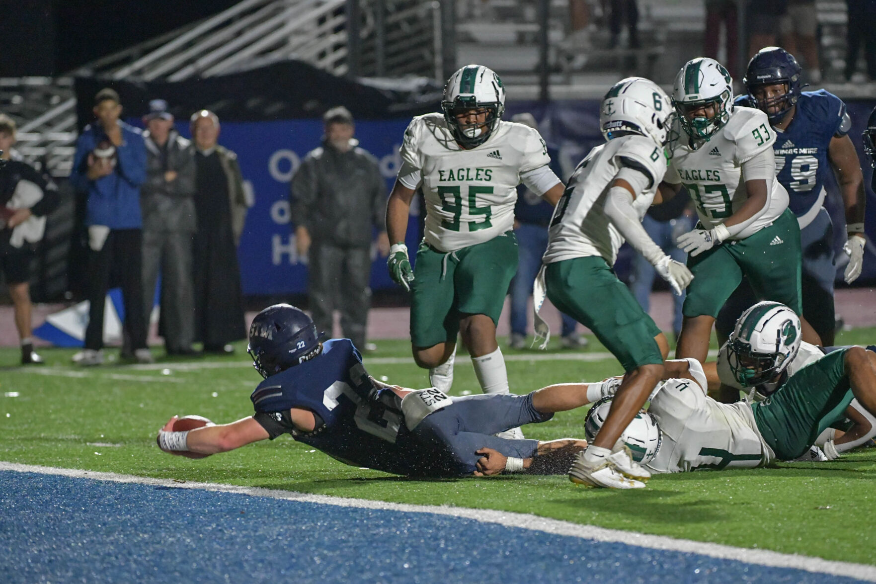 St. Thomas More Cougars Triumph in a Rain-Soaked Victory over Shaw Eagles
