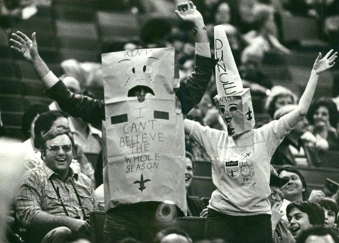 A fan wears a paper bag on his head during the Detroit Lions-New Orleans  Saints NFL football game in Detroit, Sunday, Dec. 21, 2008. New Orleans won  42-7 to drop Detroit to