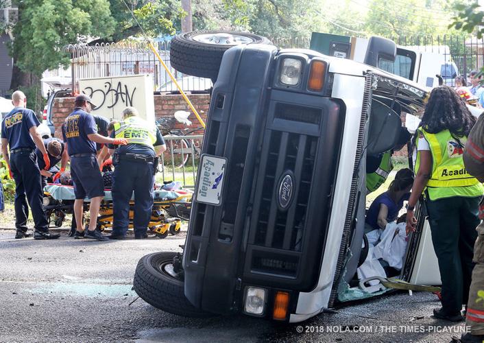 Medical transport van overturns in crash with SUV in Central City