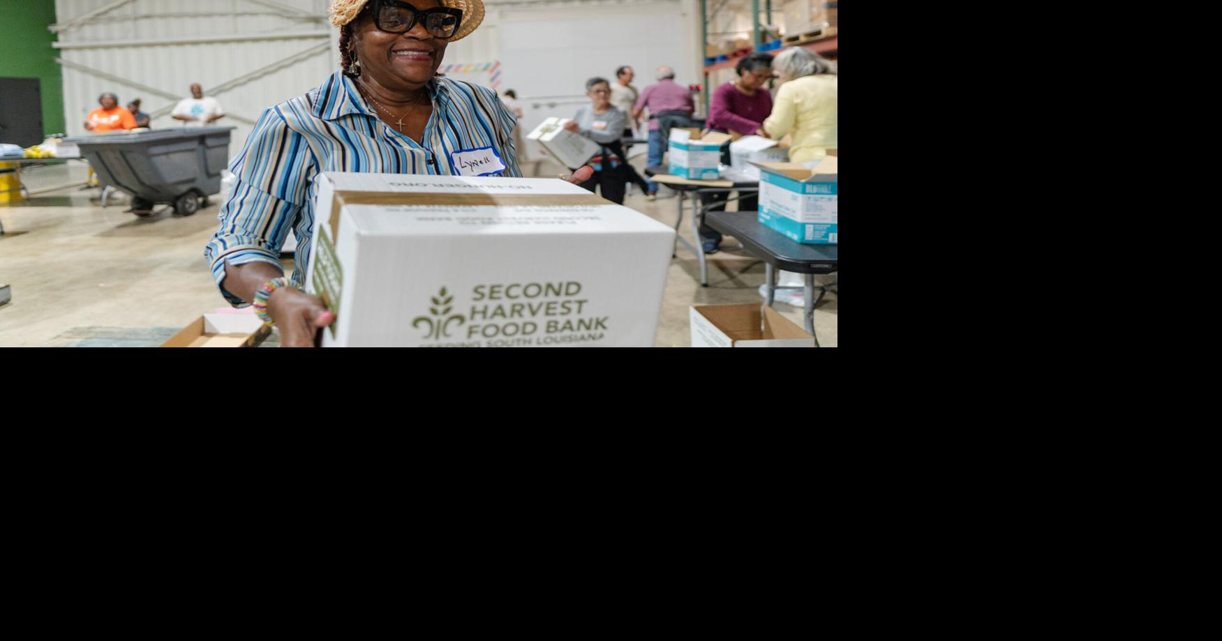 Volunteers at Second Harvest Food Bank Packing with Purpose | Photos ...