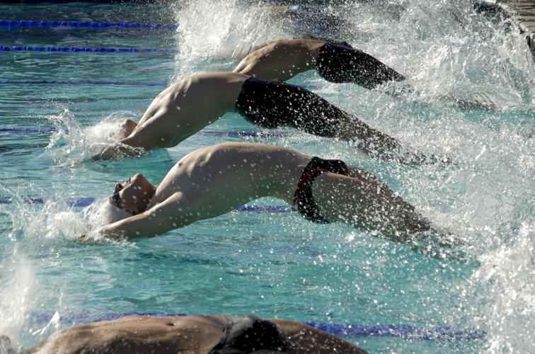 He learned to swim so his grandfather would let him go fishing. Now ...