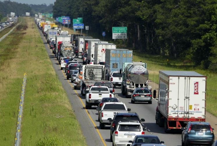 Traffic slow on eastbound I 12 after 18 wheeler loses granite load