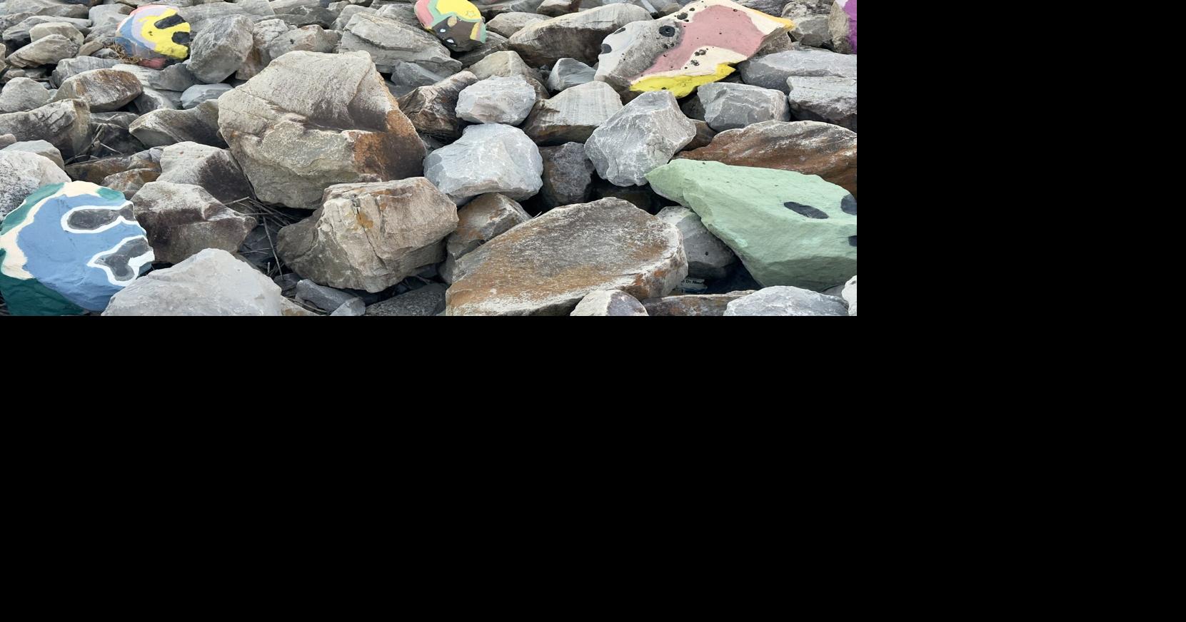 Who's been painting faces on the rocks down by the river in the New Orleans French Quarter?