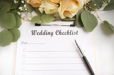Wedding planning checklist with blank space and roses