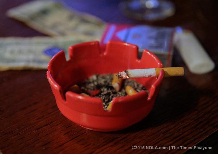 At BJ's Lounge, smoking cigarettes keeps the 'atmosphere' going Local