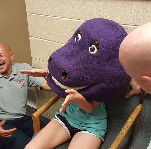 Firefighters Rescue Alabama Teen Girl From Giant Barney Head Traffic