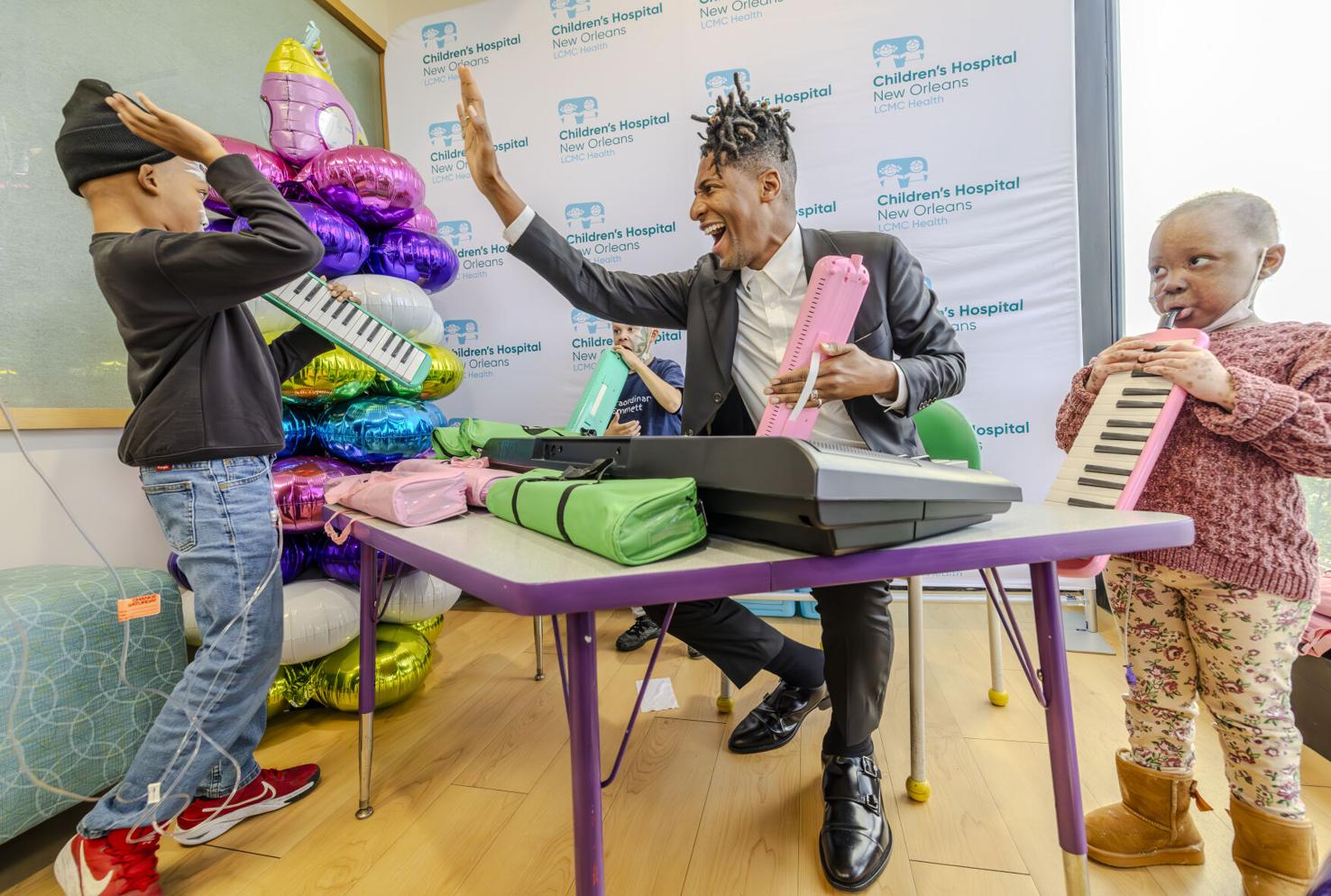 Photos: Jon Batiste brings music and love to patients at Children's ...