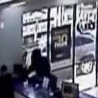 Surveillance Video Man Takes Out Gun Robs Metro Pcs Workers In