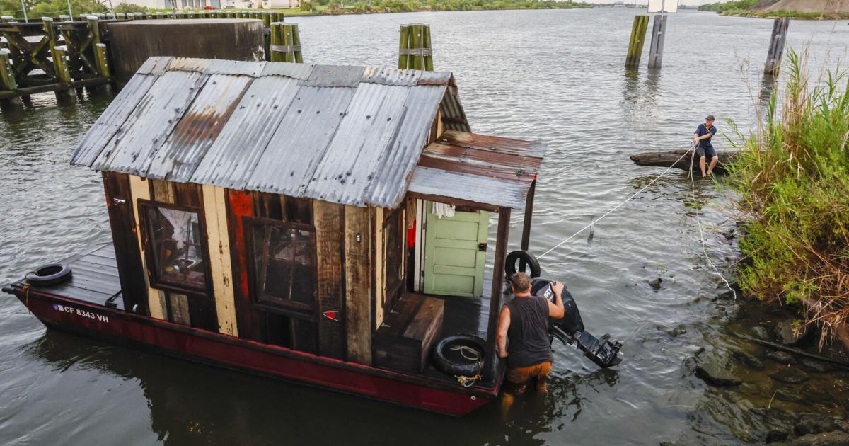 Stories, sweat and semi-automatics: A shanty boat navigates summer in south Louisiana