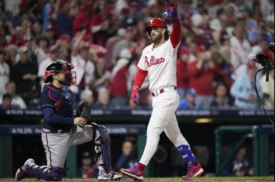 Harper, Phillies hold off Dodgers 2-1 to avoid sweep