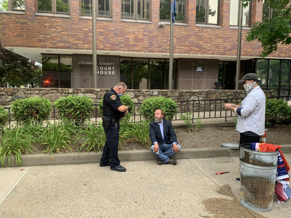 Activist burns NaziConfederate Flag outside Williamsport court house