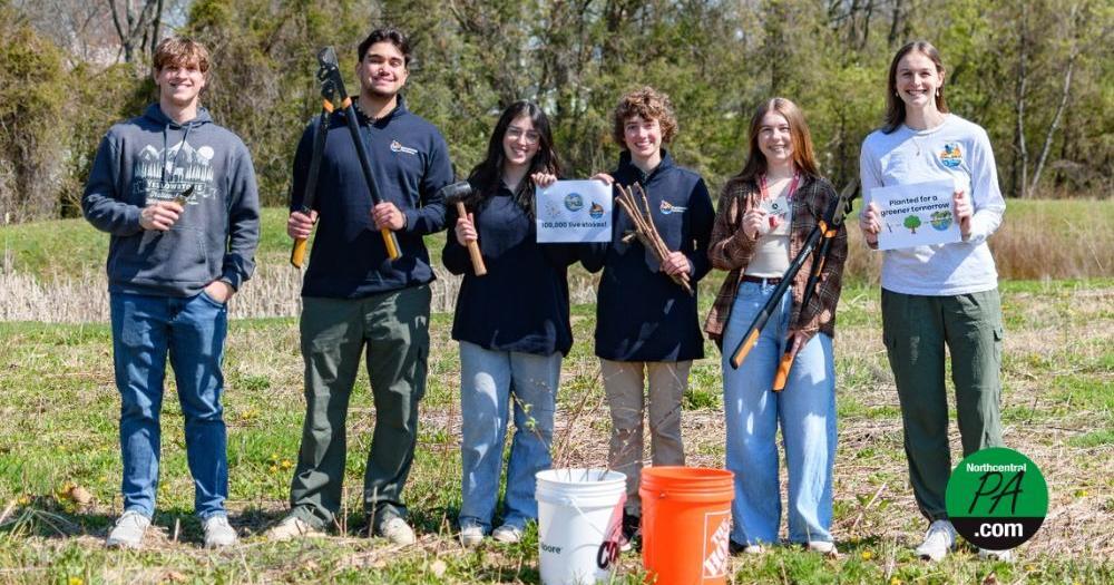 Riparian forest restoration group plants 100,000th live stake