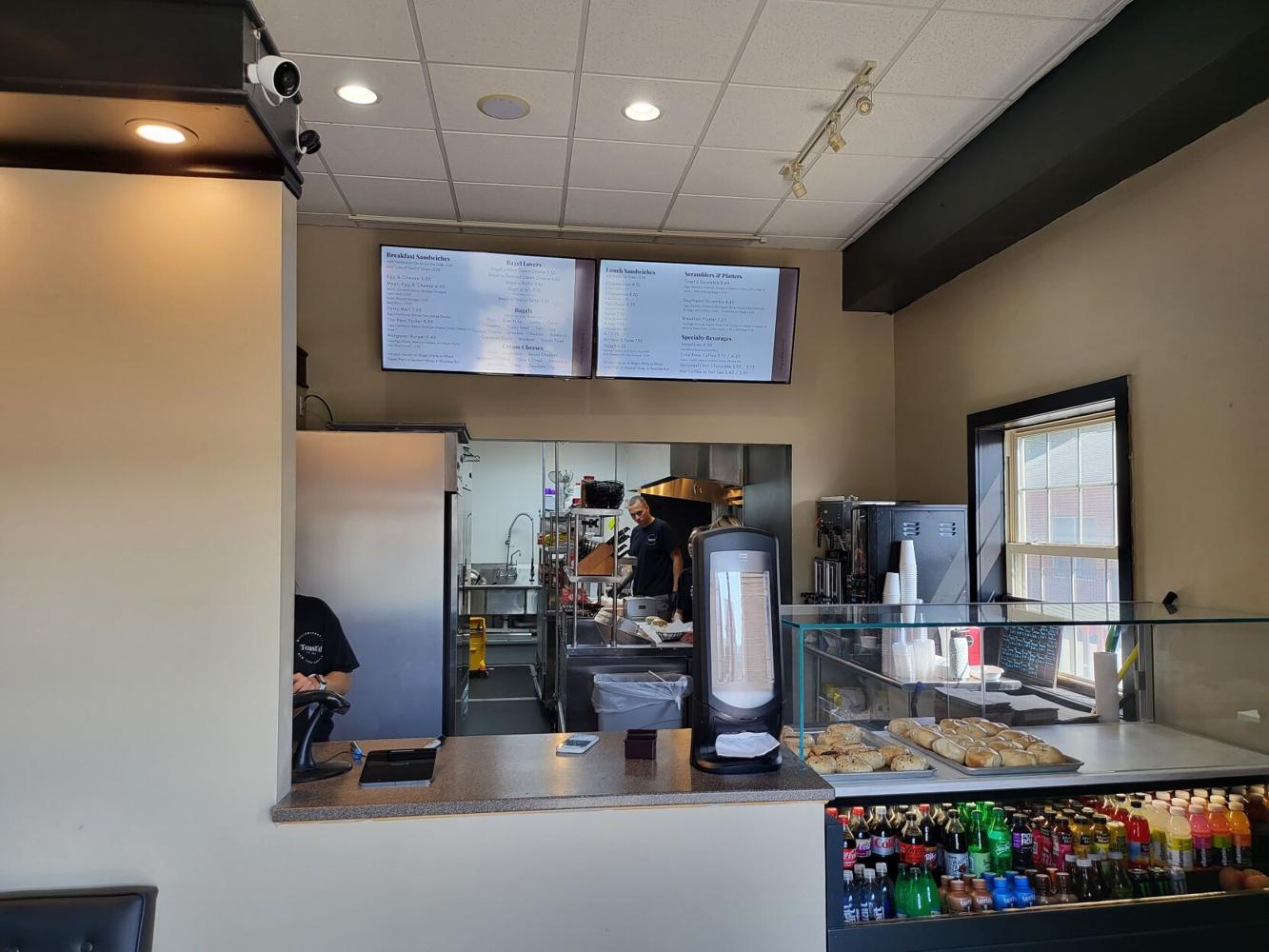 Popular bagel shops moves, expands menu Business