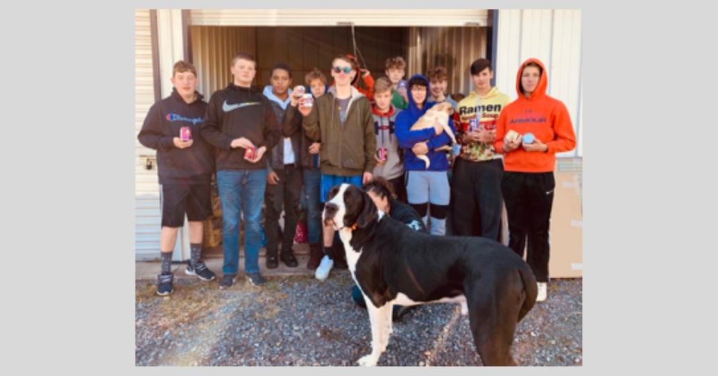 Boys (to men) help Mastiffs to Mutts Community