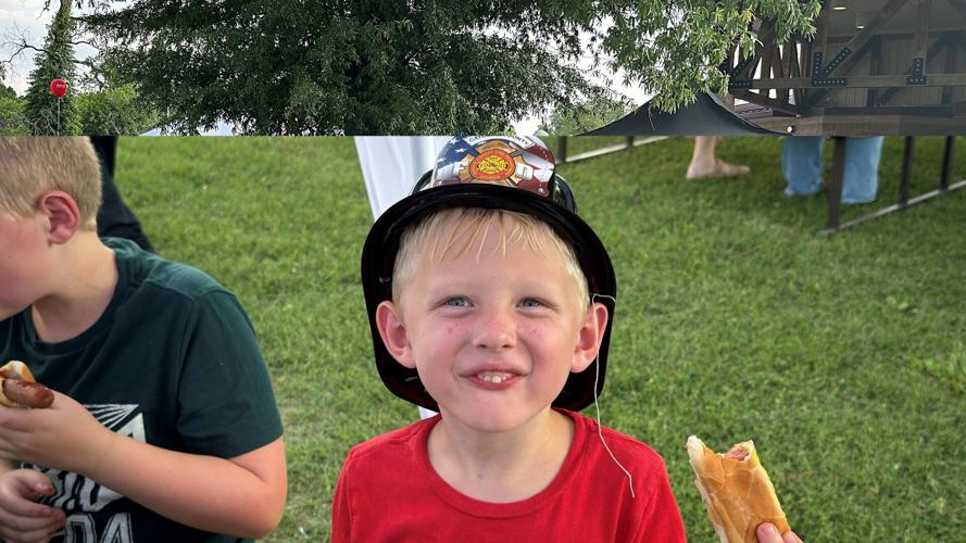National Night Out, boy eating hot dog