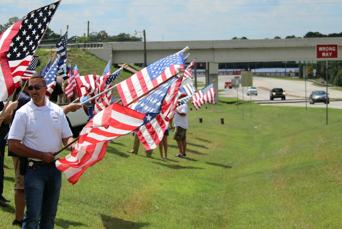 Flag waving event promotes pride, patriotism