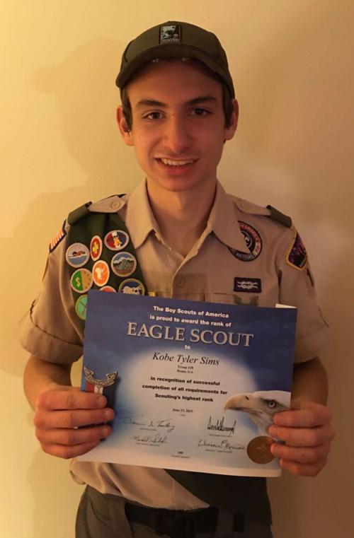 Kobe Tyler Sims earns his Eagle Scout recognition from Boy Scout Troop 118