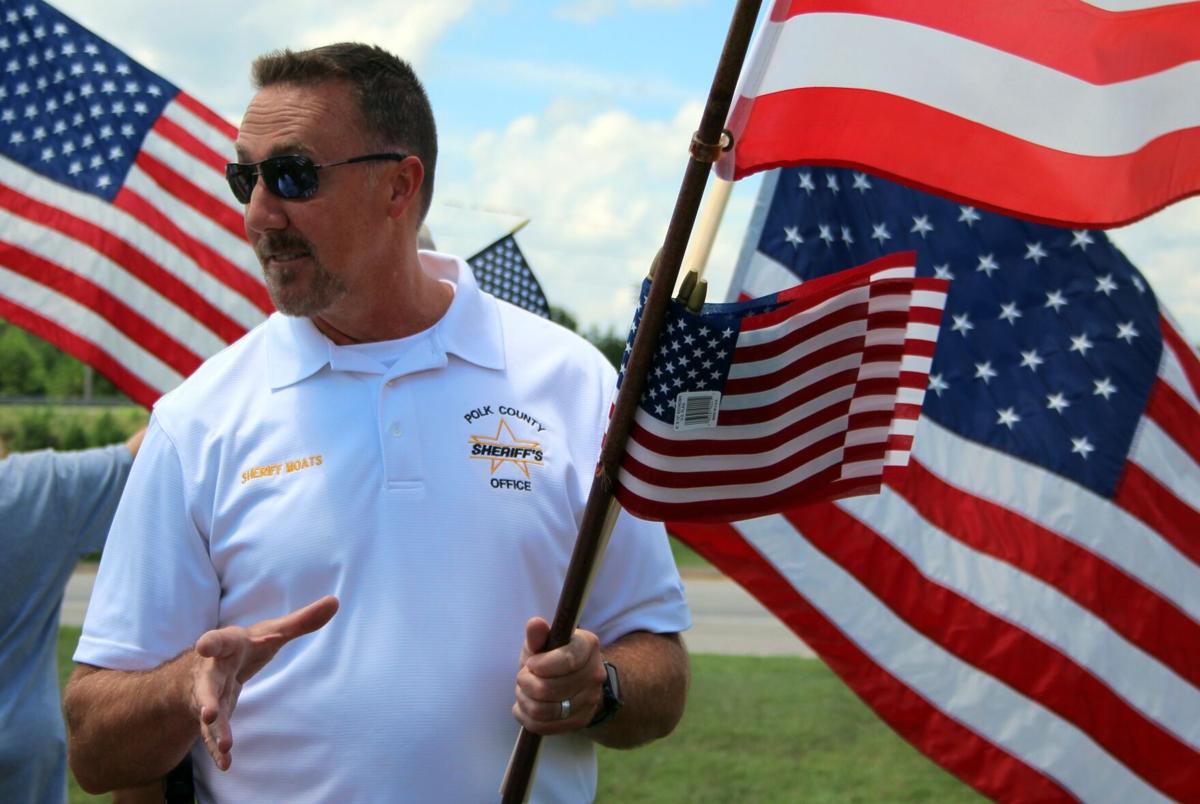 Flag waving event promotes pride, patriotism