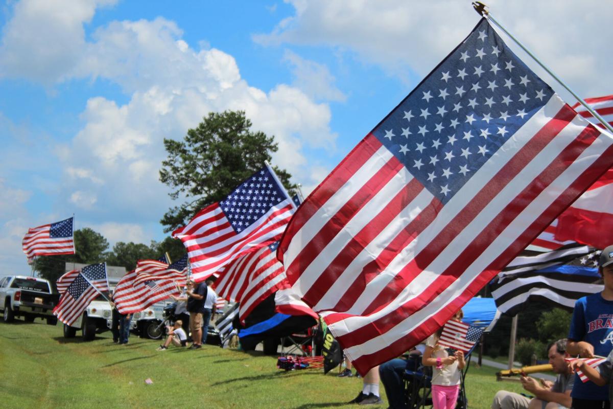 Flag waving event promotes pride, patriotism