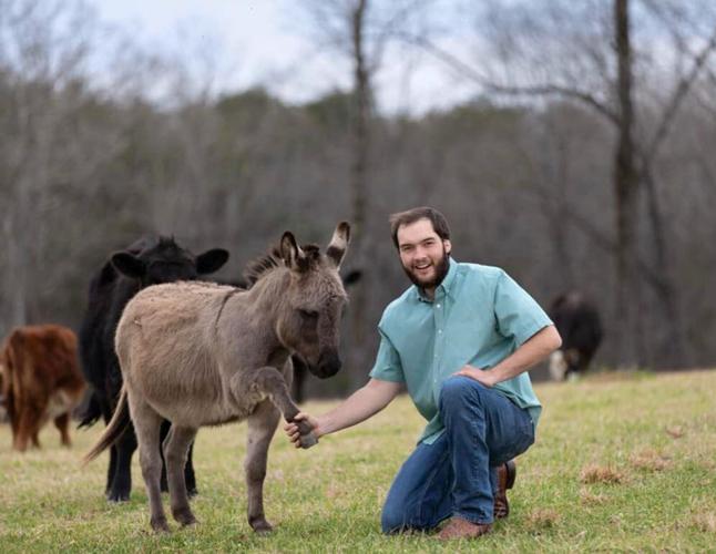 Colton Moore with donkey