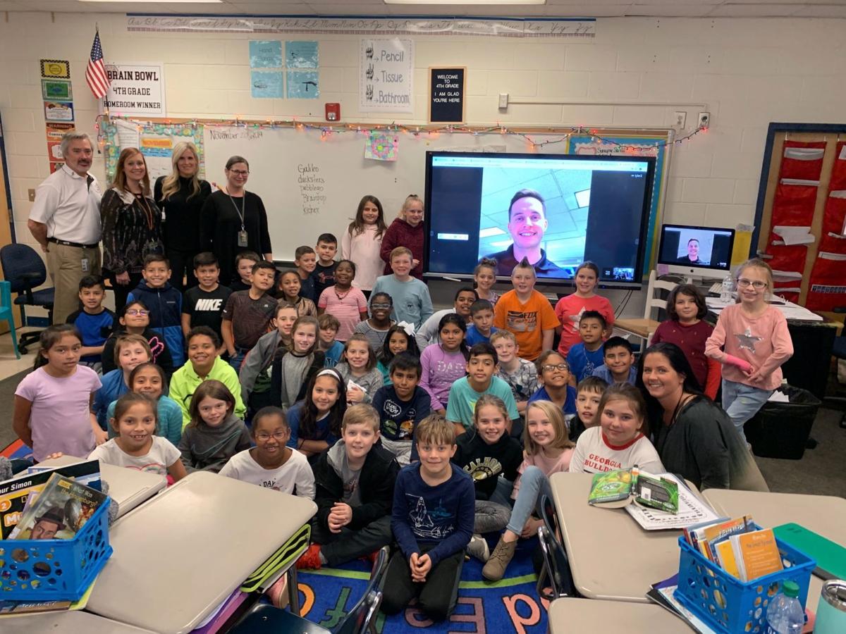 Meteorologist Tyler Mauldin connects with fourthgraders at Calhoun