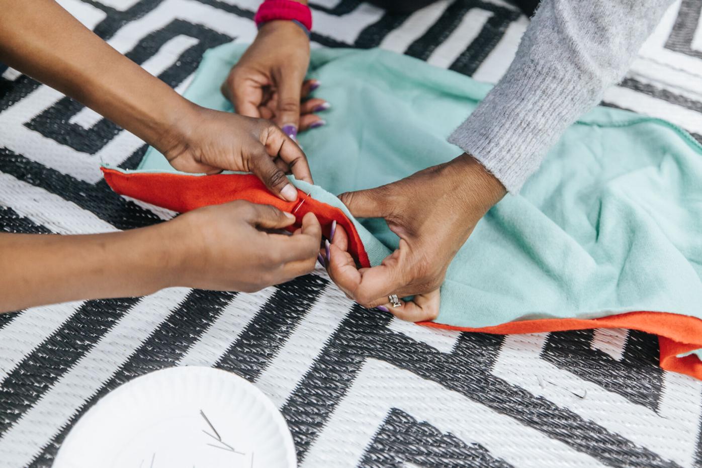 Anna K. Davie students sew scarves as part of Mission Warm Me Up