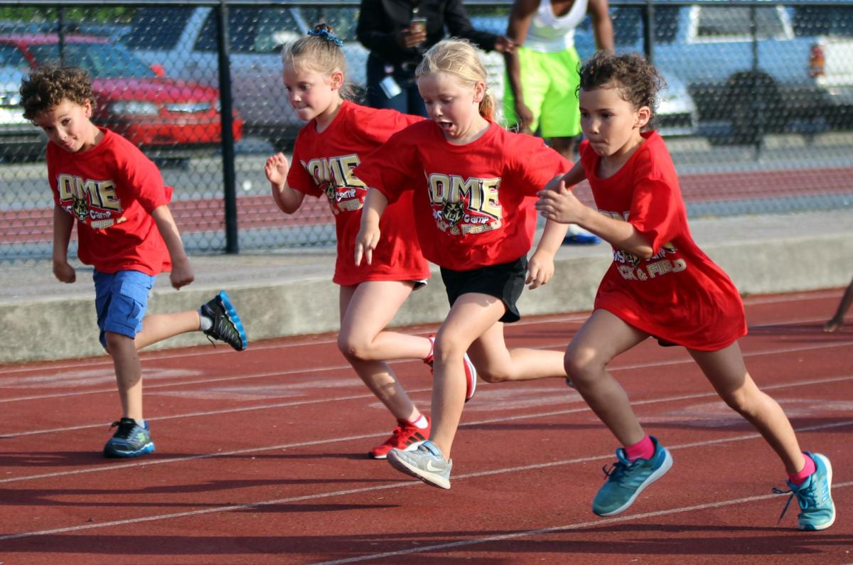 Kids stretch their legs at track and field camp Gallery