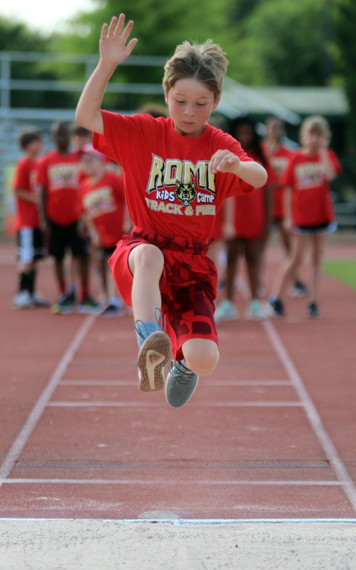 Kids stretch their legs at track and field camp Gallery