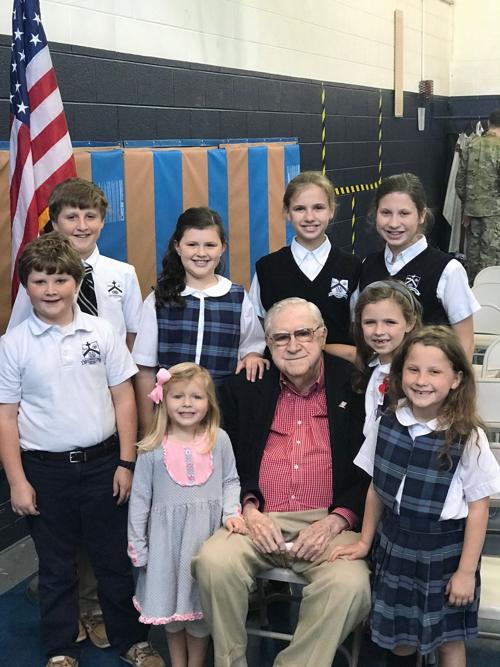 Celebrating Veterans Day with their grandfather