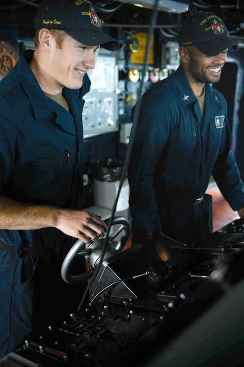 Fort Oglethorpe sailor mans the helm aboard USS Pinckney